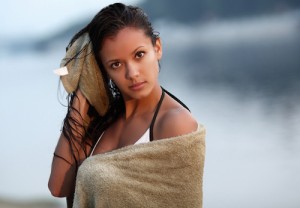 beautiful girl mulatto towel on the beach