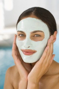 Woman smiling in beauty mud mask